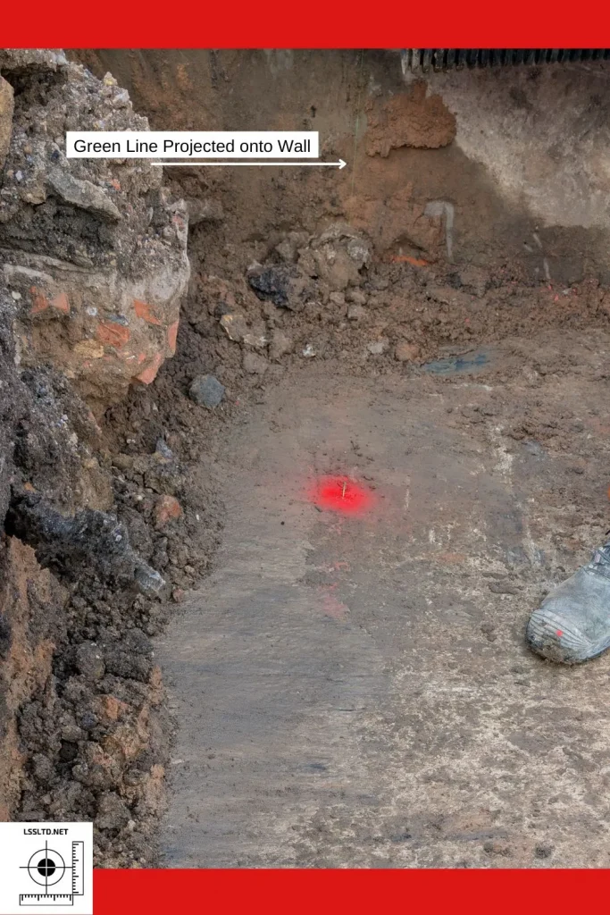 Green Laser Beam Projected onto the Concrete Wall